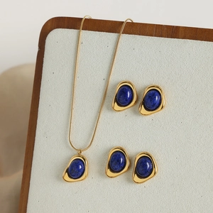 Vintage irregular geometric gold-plated jewelry set with oval blue natural stone accents
