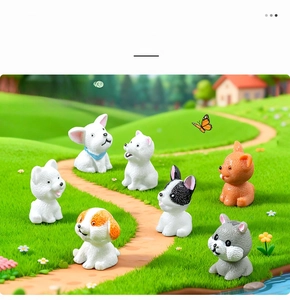 Close-up of miniature resin dogs and a hamster on a realistic grass micro landscape