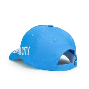 Detail view of adjustable metal buckle and blue cotton fabric on New York City baseball cap
