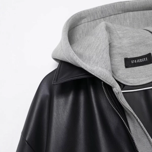 Black PU leather hooded jacket for women with grey cotton hood and metal zipper detail