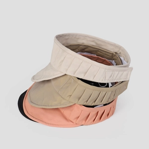 Three minimalist open-top sun hats in beige, khaki, and peach with pleated elastic bands