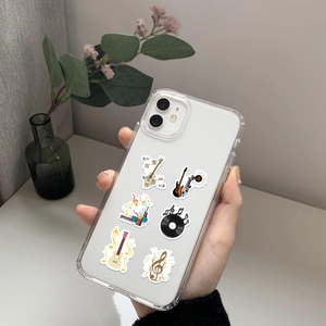 Detail of transparent phone case with musical instrument stickers and vinyl record motifs