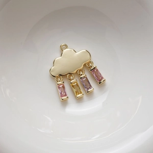 14K gold plated cloud pendant with colorful rectangular zircon stones on white ceramic