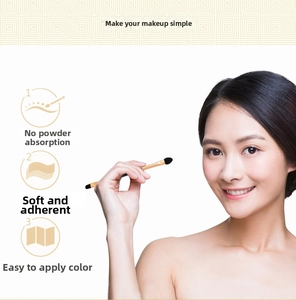 Dual-tip sponge eyeshadow brush with golden handle for soft and efficient eye makeup