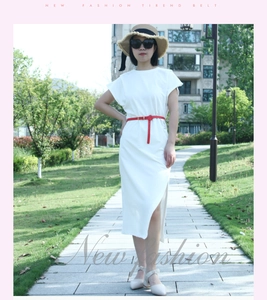 Slim red PU leather belt with gold metal buckle styled on a white summer dress for women