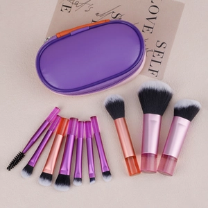 Detailed set of 10 gradient makeup brushes with purple zipper storage case on soft background