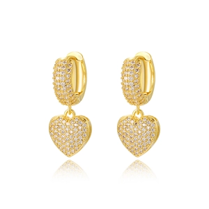 Macro detail of gold-plated heart earrings featuring sparkling full pavé cubic zirconia