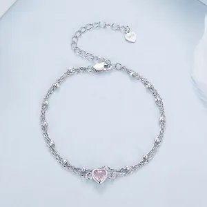 S925 sterling silver double layer bracelet with pink heart gemstone on blue background