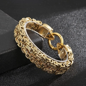 Detailed macro view of golden Byzantine chain with ornate lion head clasps on a jewelry box