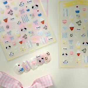 Macro view of ultra-thin nail stickers with cute macaron dogs and cat illustrations