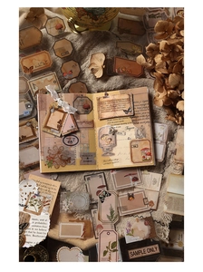 Close-up of vintage PET stickers with floral and butterfly patterns for scrapbooking