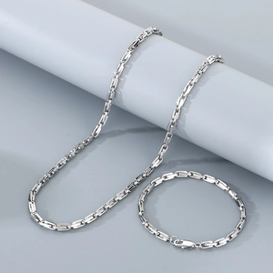 Detail of silver 4.5mm U-link chain necklace and bracelet set in polished titanium steel