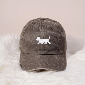 Close-up of vintage dark grey washed cotton baseball cap with white dog embroidery