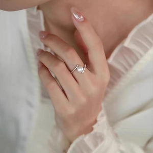 Elegant S925 sterling silver bamboo joint ring with pearl detail on woman's hand