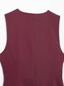 Macro detail of wine red dress featuring twill texture fabric and invisible zipper back