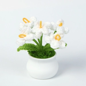Handmade crochet white lily flowers in white ceramic pot for home office desk decor
