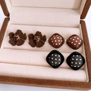 Chic velvet stud earrings set featuring brown floral and polka dot fabric patterns
