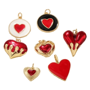 Lava heart jewelry pendants in 18k gold finish with red and black enamel accents