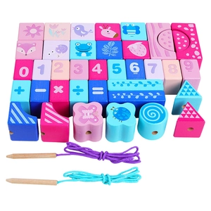 Detailed view of wooden blocks featuring numbers 0-9, math symbols, and animal shapes