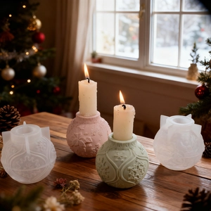 Detail view of 3D snowflake embossed silicone molds with finished decorative wax candles