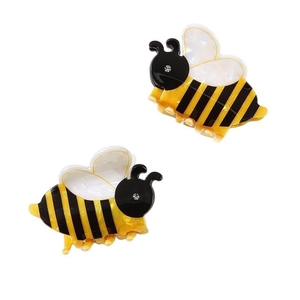Pair of cute bee hair claws with acrylic rhinestone accents on a clean white backdrop
