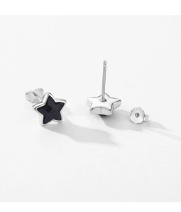 Macro shot of S925 sterling silver star earrings with glittery blue sandstone inlay