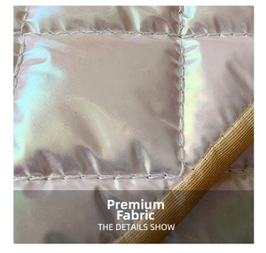 Detail show of iridescent quilted leather fabric with metallic finish and square stitching