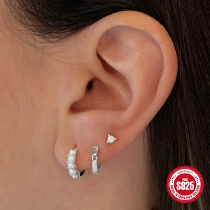 925 sterling silver hoop earrings set with elegant white opal stone on female model
