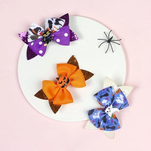 Detailed view of Halloween hair clips featuring sequins, pumpkin, witch and ghost motifs