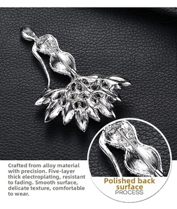 Macro detail of silver dancer brooch showing five-layer plating and polished back