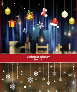 Detail view of colorful Christmas window clings featuring snowflakes, bells and stockings
