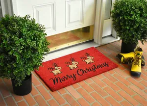 Detailed view of red Christmas reindeer doormat with non-slip texture in home entrance