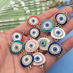 Detail of colorful enamel evil eye charms with rhinestones for DIY jewelry making