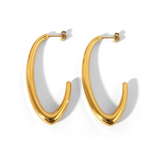 Detailed view of polished gold U-shape hollow earrings with mirror metallic finish
