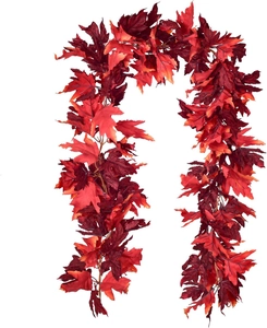 Detailed view of red artificial maple leaf garland with realistic texture for autumn decor