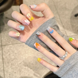 Handmade short press-on nails featuring colorful hand-painted cartoon cat patterns