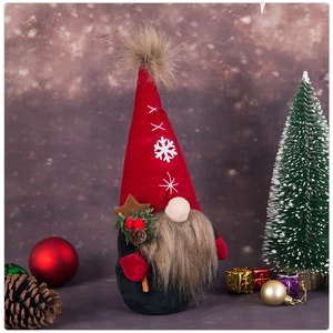 Detail of Christmas gnome plush with pine cones, berries and snowflake embroidery