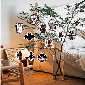 Detail of wooden Halloween hanging ornaments on tree branches for party decoration