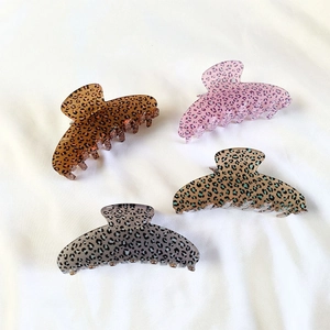 Set of four large leopard print claw clips for thick hair in assorted acrylic colors