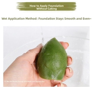 Close-up of wet green teardrop makeup sponge being rinsed under water for damp use