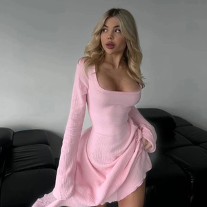 Detailed view of pink square neck long sleeve dress showing crinkle texture and slim fit