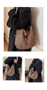 Detail view of stylish leopard print crossbody bag with black shoulder strap and metal buckle