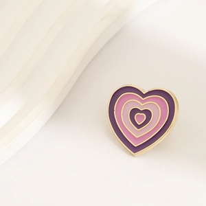 Rainbow gradient purple pink heart enamel brooch with gold metallic border on white wavy base