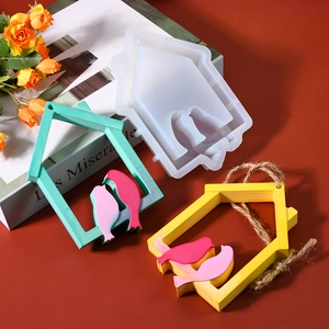 Macro view of bird house silicone mold with 3D resin bird pendant DIY hanging crafts