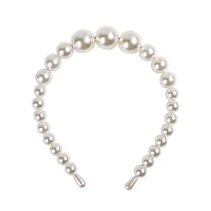 Minimalist white pearl headband with graduated beads on a thin frame for women