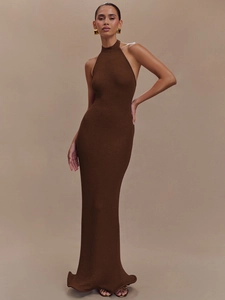 Elegant dark brown halter neck sleeveless knitted maxi dress for women on beige backdrop