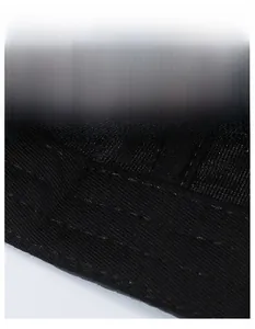 Close-up of the widened sweatband with breathable knit texture on a black sports cap