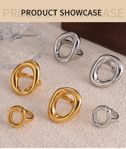 Detail shot of irregular hollow gold and silver rings with high-polish mirror finish