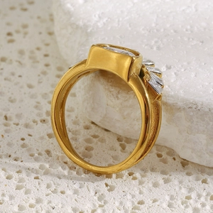 Detail of 18K gold plated double layer ring with rectangular zircon and side stones
