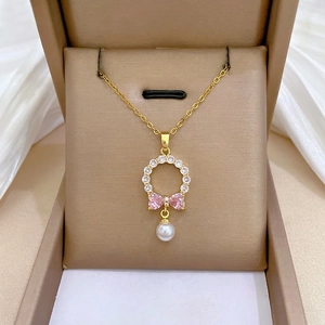 Elegant titanium steel bow jewelry set with pearls and crystals in a luxury gift box